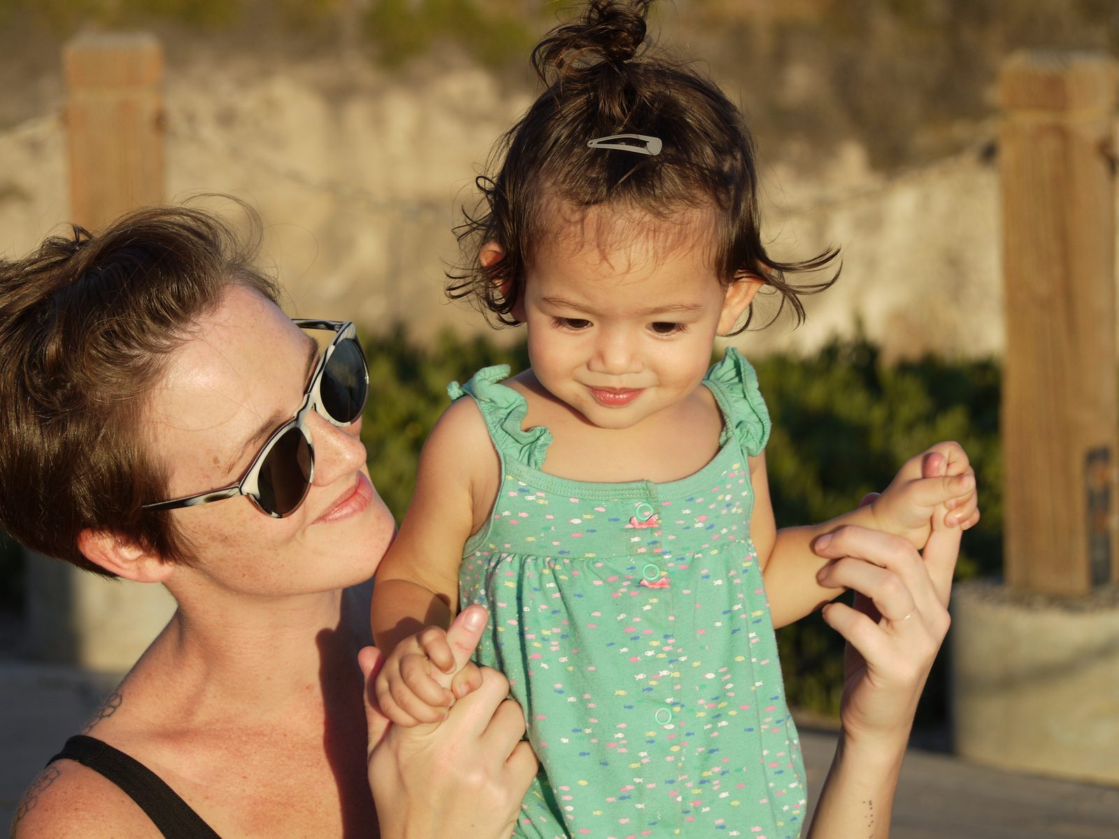 Cassie holding her daughter as a toddler